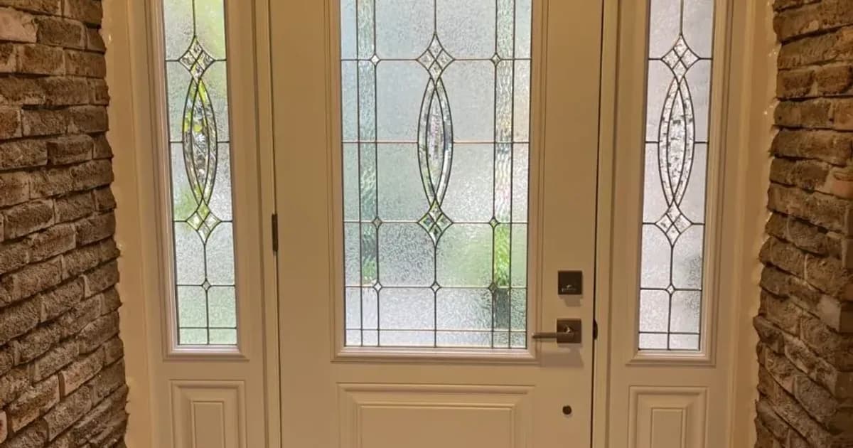 Front entry door on a home in Burlington, Ontario — winter latch adjustment